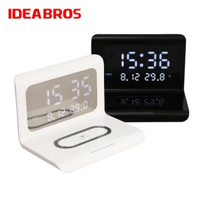 China Creative Multi-functional Wireless Charger LED Alarm Clock Mobile Phone Tablet Charging Shell Aluminum Radio Clock Portable Digital Mute for sale