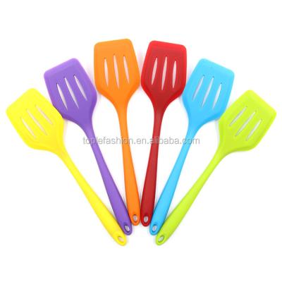 China Best Viable Large Flat Solid Silicone Slotted Spatula With Stainless Steel Core for sale