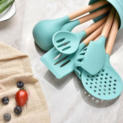 China Sustainable 8PCS Silicone Kitchen Cookware Tool Kit With Wooden Handle for sale