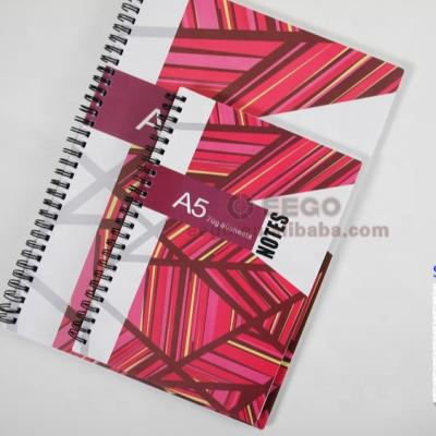 China A4 exercise book spiral desk writing book custom logo printing a5 square spiral notebook for sale