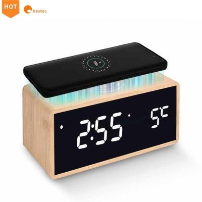 China Hot Selling Amazon Mobile Phone 4 in 1 Wireless Charger Mirror LED Display Charger Bamboo Wooden Acrylic Radio with Alarm Clock for sale