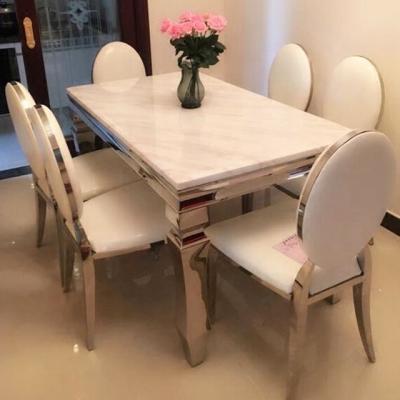 China Modern Design 10 Seater Luxury Metal Dining Table Fashion Tables And Chair Set Metallic for sale