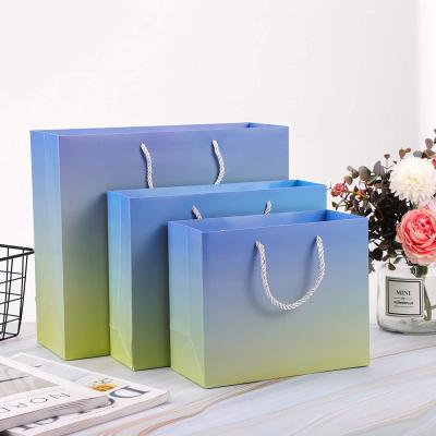 China Luxury Recycled Materials Bags With Ribbon Paper Gift Bags For Shopping for sale