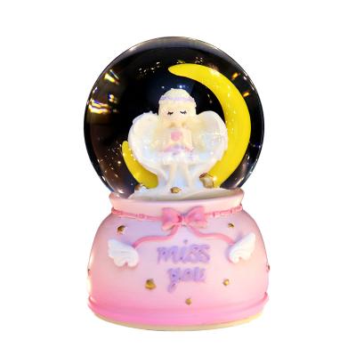 China Europe Factory Wholesale New Moon Crystal Ball Snowflake Gift Send Angel Crystal Ball Birthday Gift Music Box Desktop Decorations for sale