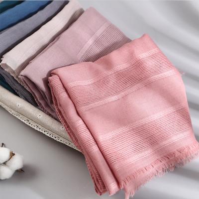 China Cotton Canvas New Style Hollowed Out Cotton And Solid Color Muslim Hijab Canvas Scarf For Women Shawls for sale