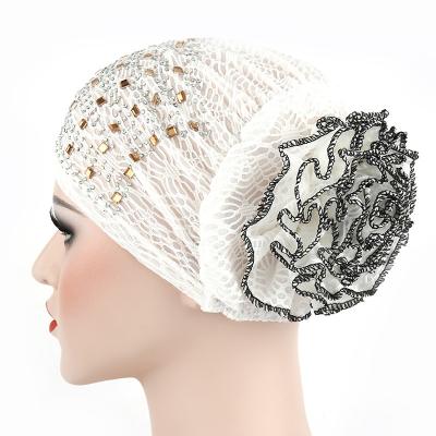 China Wholesale Multicolor Hot Drilling Style Muslim Hat Turban Hat Flower Coil Character New New Holes Pleated Knitted Hats for sale