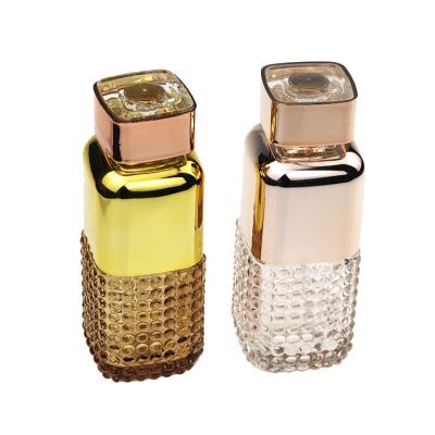 China Factory Modern Luxury Cosmetic Design 120ml Embossed Empty Glass Rectangle Perfume Bottle Crimping for sale