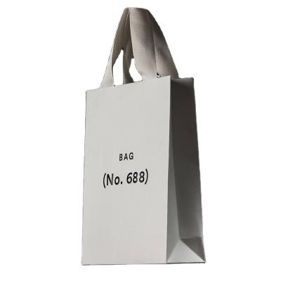 China Recyclable Wholesale Custom Printing Kraft Paper Shopping Paper Bags With Your Own Logo for sale