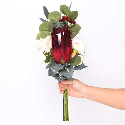 China New Style Real Touch Natural Touch Protea Artificial Hand Holding Dry Flower Bouquet Wedding for sale