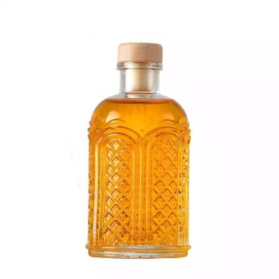 China Beverage Short Neck Triangle Shape Whiskey Bottles Transparent Stripe And Embossing Anti-skidding Thick Bottom for sale