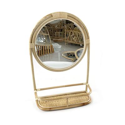 China Custom Home Natural Rattan Look Craft Decor Rattan Framed Wall Mirror With Shelf Basket for sale