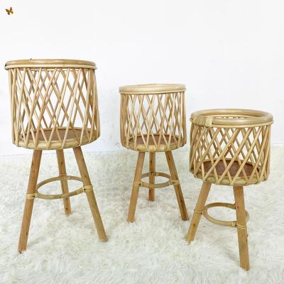 China Rustic Cane Wicker Plant Flower Pot Stand Rattan Look Handwork Home Decor Rattan Plant Stand Showing Basket for sale