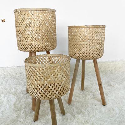 China Eco-Friendly Natural Bamboo Rattan Look Rattan Plant Rack Stretch Plant Flower Pot Display Rack Indoor Outdoor Basket for sale