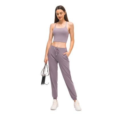 China Breathable Women Tracksuit Joggers Sport Ladies Joggers Pants Women' s pants with side pockets for sale