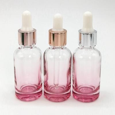 China Clear Wholesale Pink Essential Oil 20ml 30ml 30ml 50ml New Designer Personal Care Serum Dropper Glass Bottle for sale