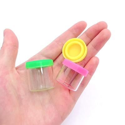 China Eco-friendly Mini Jar 5ml Glass Silicone Soft Lid 6ml Wax No Neck Concentrate Oil Container Jars Packing Silicone Glass Cap for sale