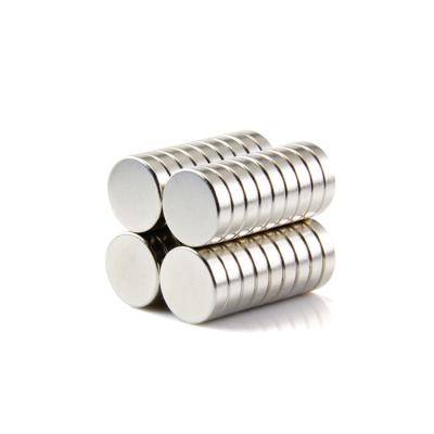 China Small Home Refrigerator Magnets Industrial Magnet Axial N35 ±3% Tolerance 12mm X 3MM for sale