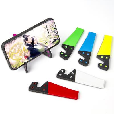 China Portable Simple V Shape Mobile Phone Stand Convenient Easy Carrying Universal Stand For Ipad Tablet for sale