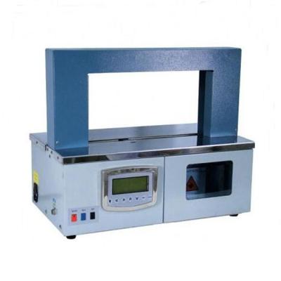 China CLOTHING Table used bandaging machine/products small size banding machine with paper or opp belt strapping for sale