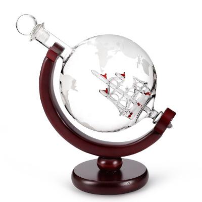 China Sustainable 850ml Amazon Etched World Globe Decanter With Crafted Wooden Glass Vessel Base For Whiskey for sale