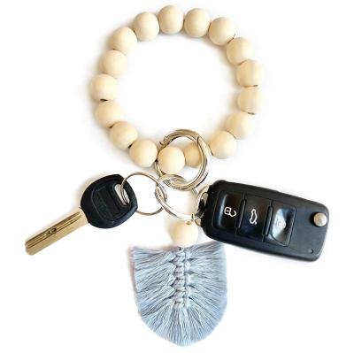 China Best Selling Daily Life Vintage Wood Bead Key Ring Bracelet Bohemian Tassel Car Key Chain Bracelet for sale