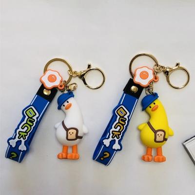 China Cute Cartoon Anime 3d PVC Key Chain Tilted Silicone Rubber Bag Duck Key Chain PVC Key Pendant for sale