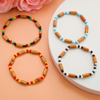 China CLASSIC Wooden Long Bead 4pcs/set Simple Colorful Fashion Flexible Student Retro Lovers Hand Rope Gifts Beaded Unisex Jewelry for sale