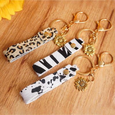 China CLASSIC Creative Leather Alloy Shape Ring Sunflower Key Pattern Leopard Fashion Pendant Key Chain For Women Girl Decoration Jewelry for sale