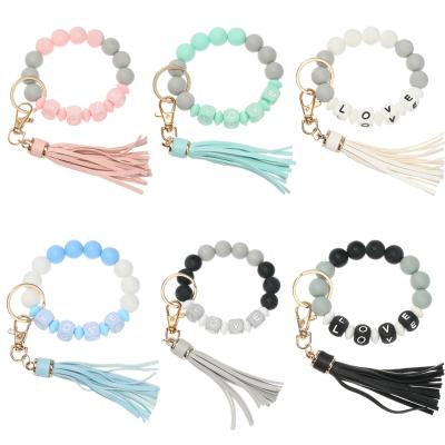 China Silicone Leather Round Beads and Square Mixed Beads Bracelet LOVE Key Chain for Car Ring PU Tassel Candy Color Bracelet Key Chain for sale