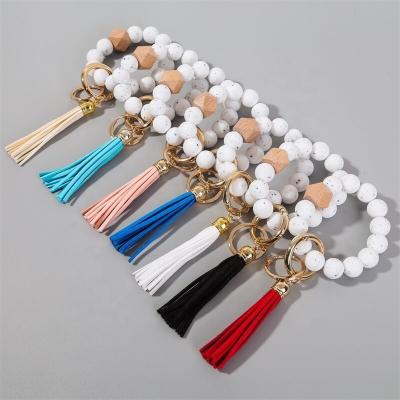 China Colorful Silicone Wristband Beaded Keychain Leather Tassel Wristband Festival Gifts Party For Fashion Home Creative Women Key Chain for sale