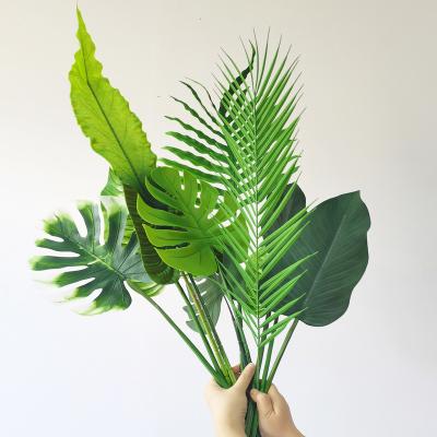 China Nature lowest wholesale price factory artificial palm tree leaves for stage decoration for sale