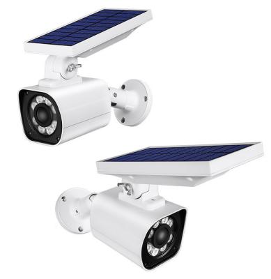 China 2021 Newest Factory Price Solar Panel IP66 Waterproof Dummy Camera Garden Security LED Solar Garden Lighting With Sensor for sale