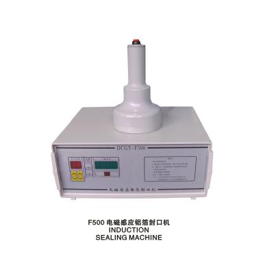 China Beverage Cheap Price Semi-automatic Induction Sealer Aluminum Foil Sealing Machine for sale