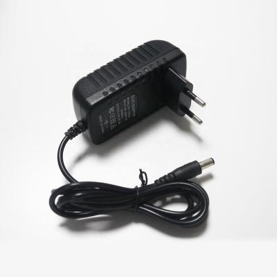 China Customize Logo Power Supply Adapter 12v 2a Wall Plug AC DC Power Mass GLT-666 Adapter for sale