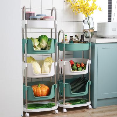 China Movable Rotating Stored Storage Rack Carts Floor-standing Multi-layer Vegetable Fruit Rack Hollow Storage Household Basket for sale