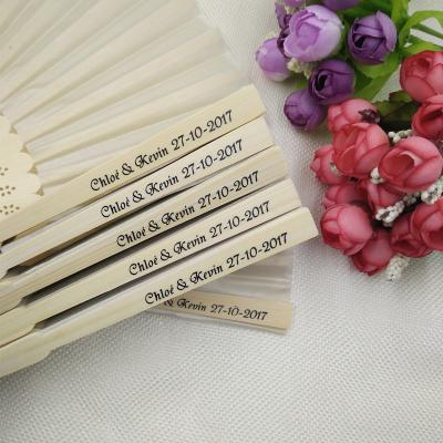 China Wedding Favors Gift Wedding Favors Gift Wedding Folding Hand Fan Wedding Silk Gift Bag Customized Logo Promotional Fan for sale