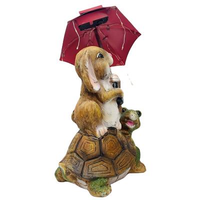 China Modern Easter Decor Bunny Solar Garden Statue Outdoor, Rabbit Sitting on Turtle Holding Umbrella with String Lights for sale