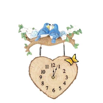 China Eco - Friendly Hand Painted Budgies Hanging Resin Wall Clock for sale