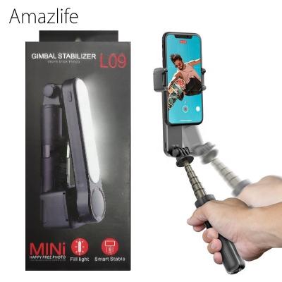 China Remote Rotating Selfie Stick L09 Smart Phone Gimbal Rotating Stabilizer Radio Selfie Stick with Tripod Mount for sale