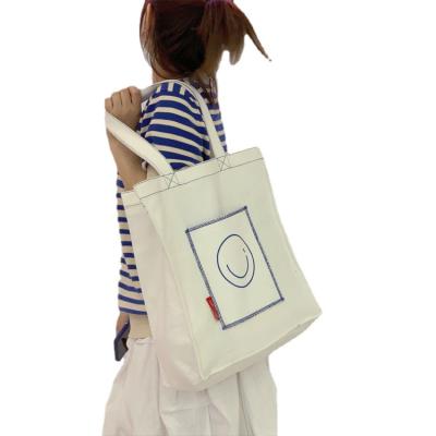 China New Large Capacity Single Shoulder Student Handheld Leisure Canvas Tote Bag With Pocket Women Eco-friendly Canvas Bags Custom Logo for sale