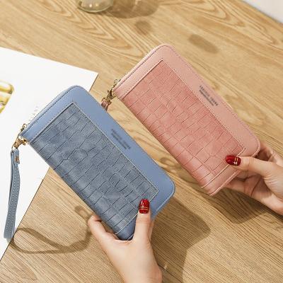 China No stone grain ladies wallet wholesale factory women long purse zipper phone wallets with bracelet for sale