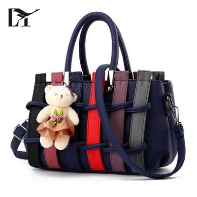 China 100% Lingyue Girls Handbag HB1010 High-end Dark Blue Eco-friendly Faux Rattan Material Leather Handbags With Cute Doll for sale