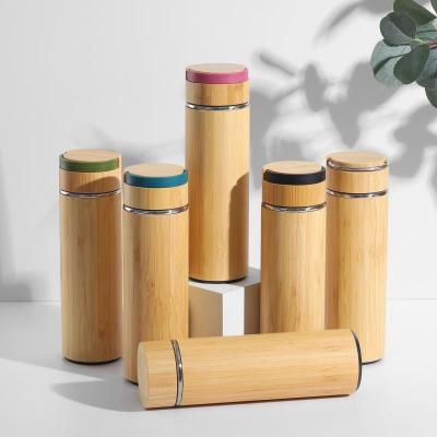 China Sustainable Eco-friendly 304 Stainless Steel Water Bottles Double Wall With Bamboo Cover Upright Tumbler With Bamboo Lid for sale