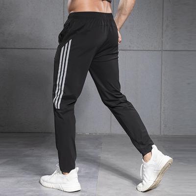 China 2022 Anti-wrinkle men's sports pants training pantsplus size running men's fitness pants and pants men's pants and pants for sale