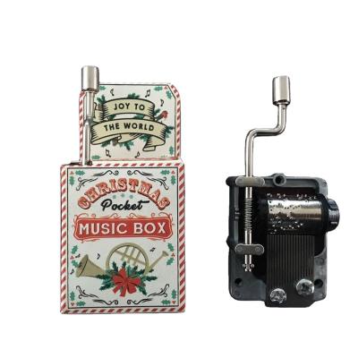 China Plastic+Metal+Paper Personalized Classic Crank Paper Music Box for sale