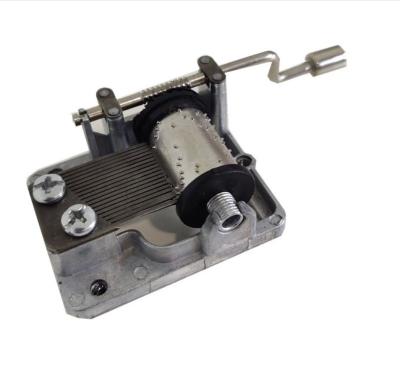 China Plastic & Alloy Custom Wind Up Music Box Silver Crank Music Box for sale