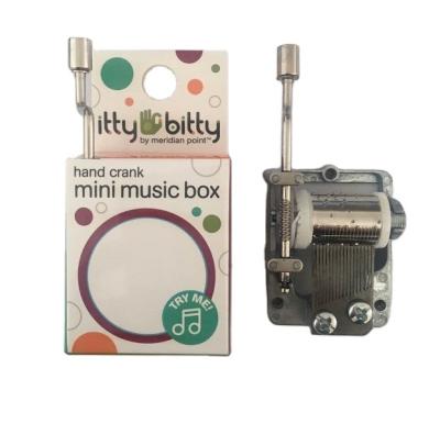 China Zinc Alloyed Customized Melody Hand Crank Paper Made Music Box For Sale for sale