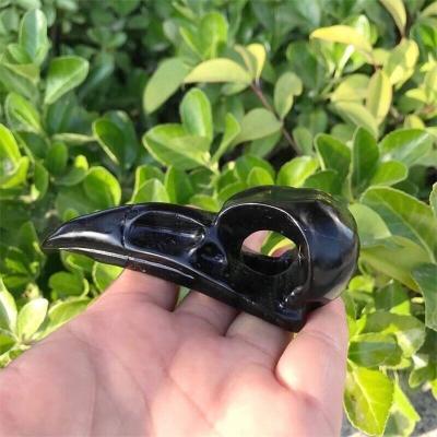 China Natural Hand-carved Mineral Crystal Bird Head Statue Animal Part Decoration Of Europe Black Obsidian Skulls for sale