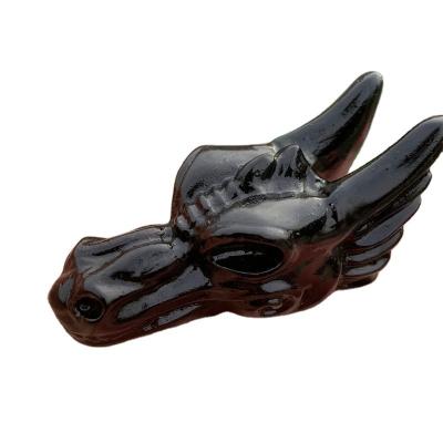 China Natural Obsidian Dragon Head Skulls Statue Carved Crystal Figurine For Home Decoration from Europe for sale