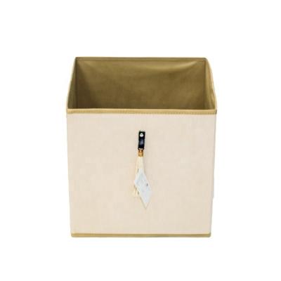 China Custom Tassel Decorated Beige Color Cube Box Suede Woven Fabric Storage Box Organizer 2021 Viable Foldable Fabric Storage Box New No for sale